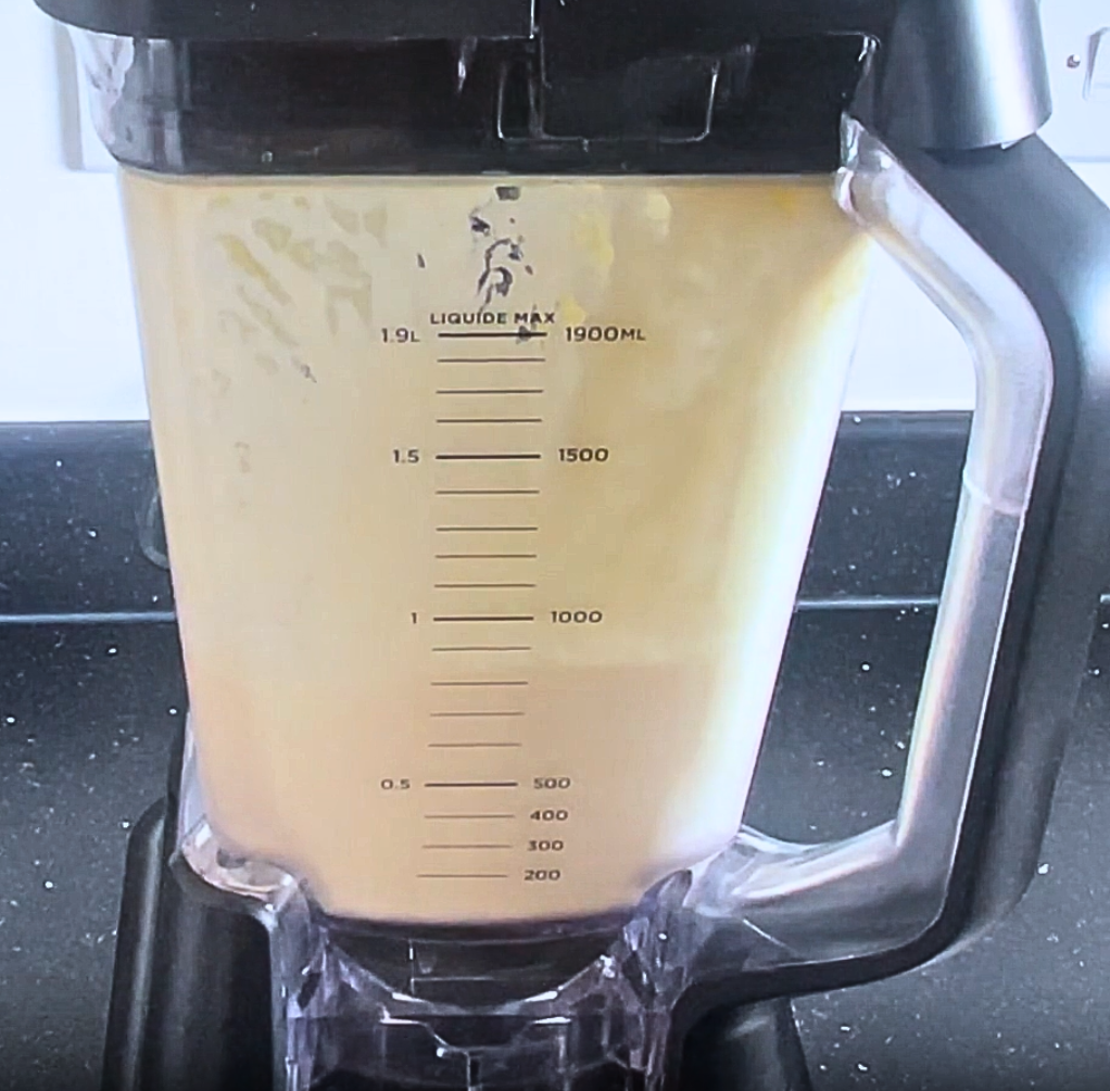 blended pineapple and coconut milk in ninja blender