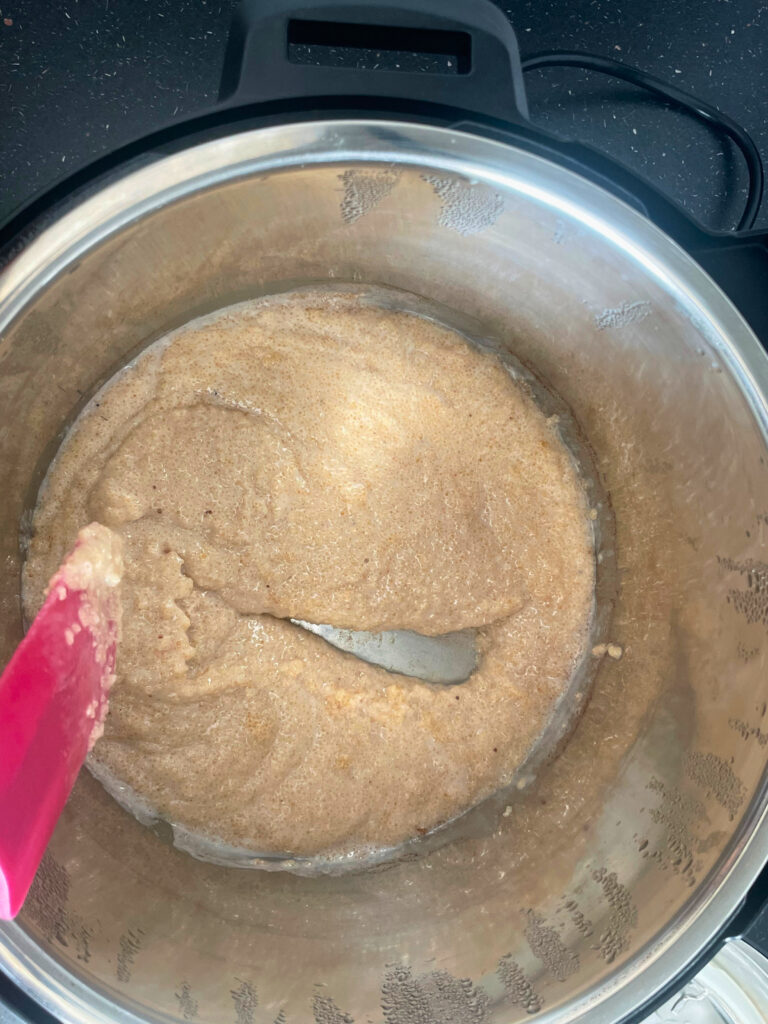 Amaranth porridge in Instant Pot with 
 scrape from a spatula through the cooked amaranth