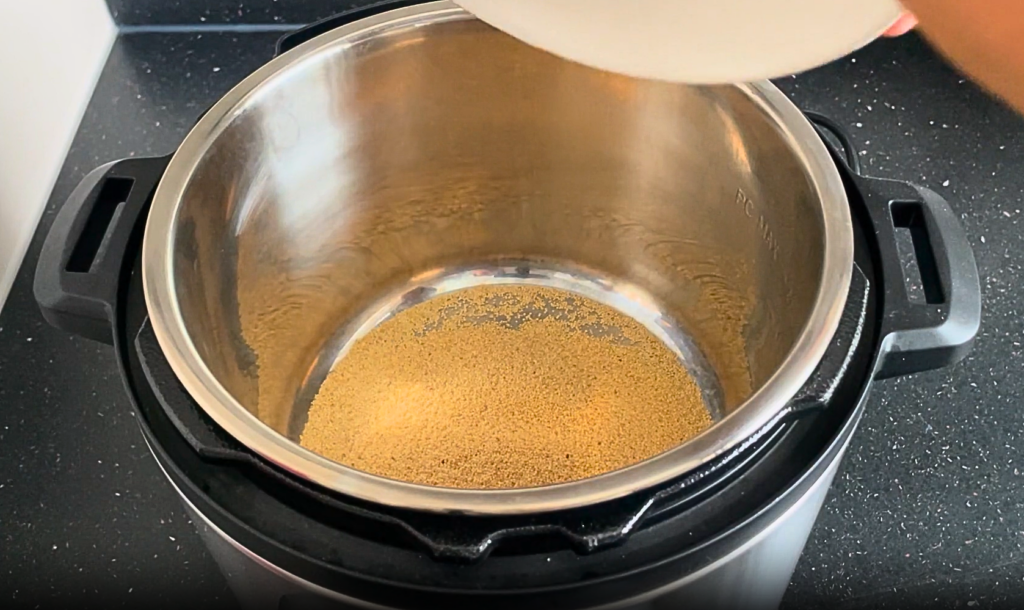 Amaranth being added to the Instant pot