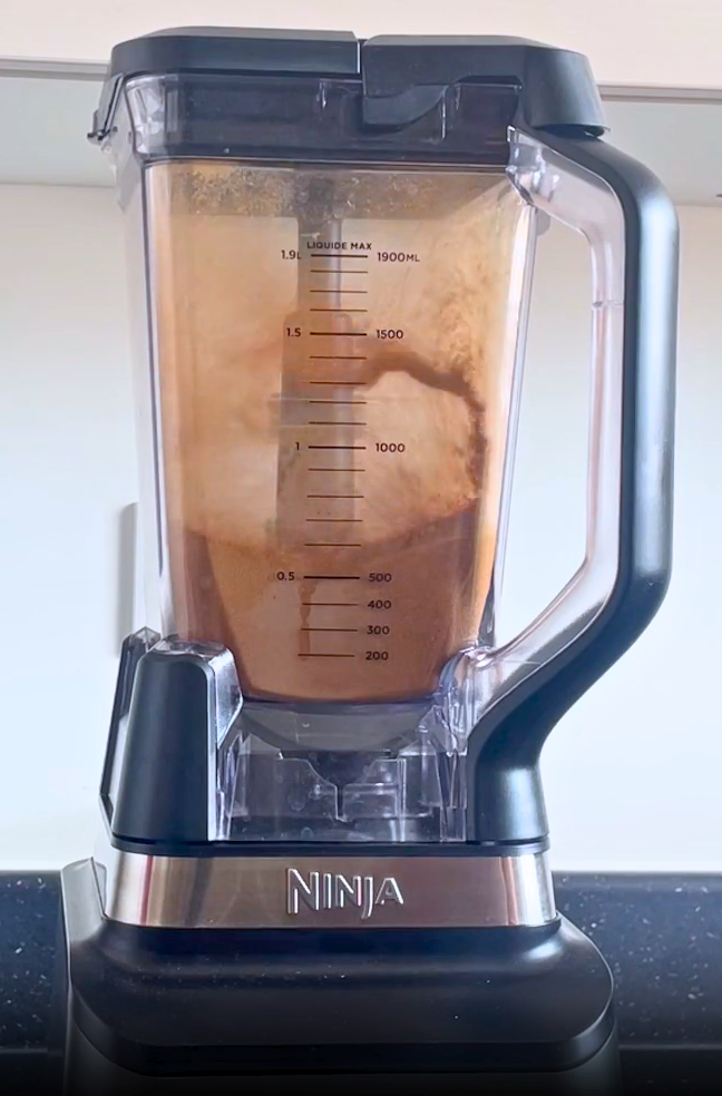 Coconut sugar being blended in Ninja blender