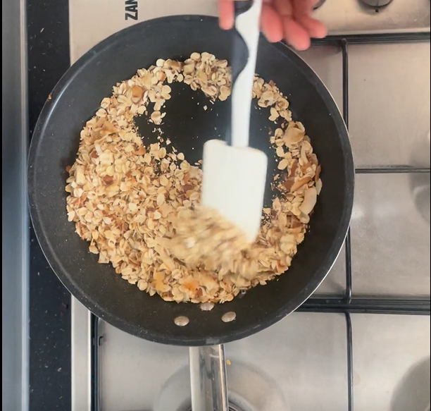 Stirring dry ingredients in hot non-stick pan