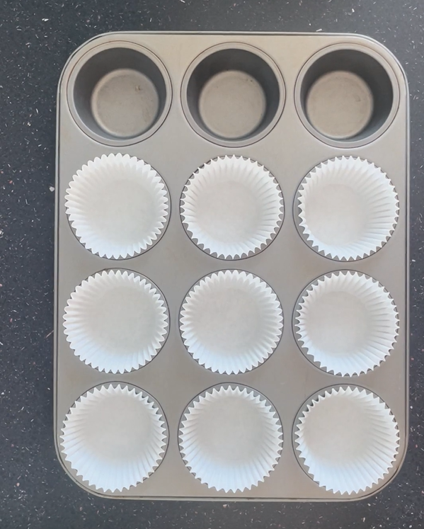 Added cupcake liners to muffin tin