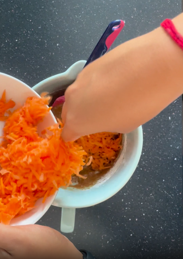 Adding in grated carrots