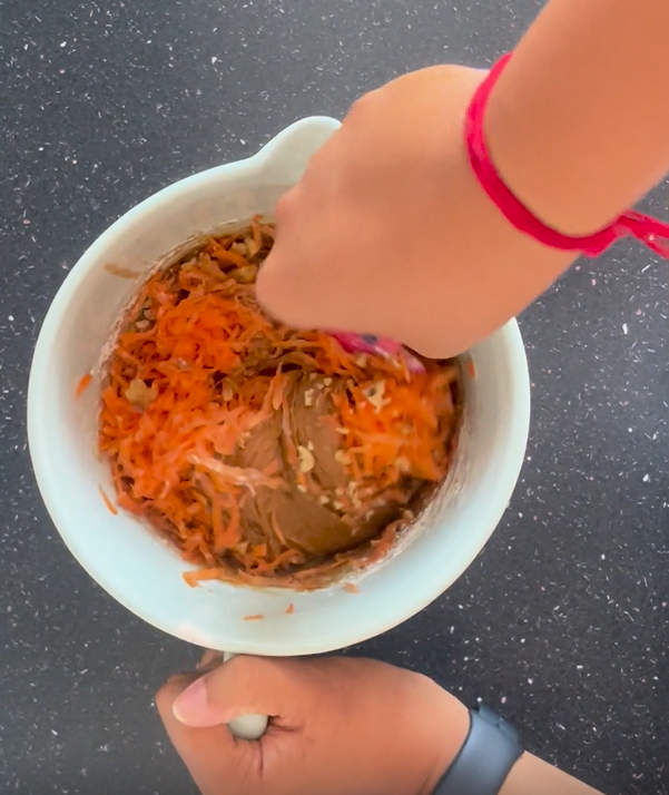 Fold in carrots and chopped pecans into the batter