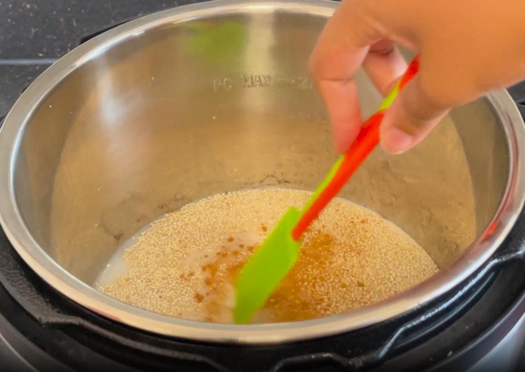 Mixing ingredients in the instant pot with a spatula