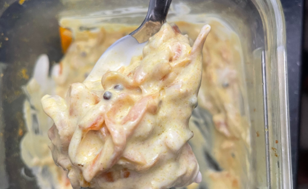 Carrot raita on a teaspoon